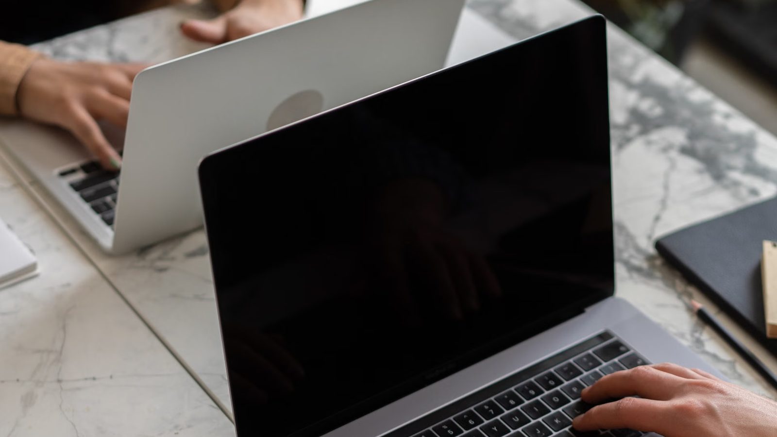 Website code shown on a laptop screen