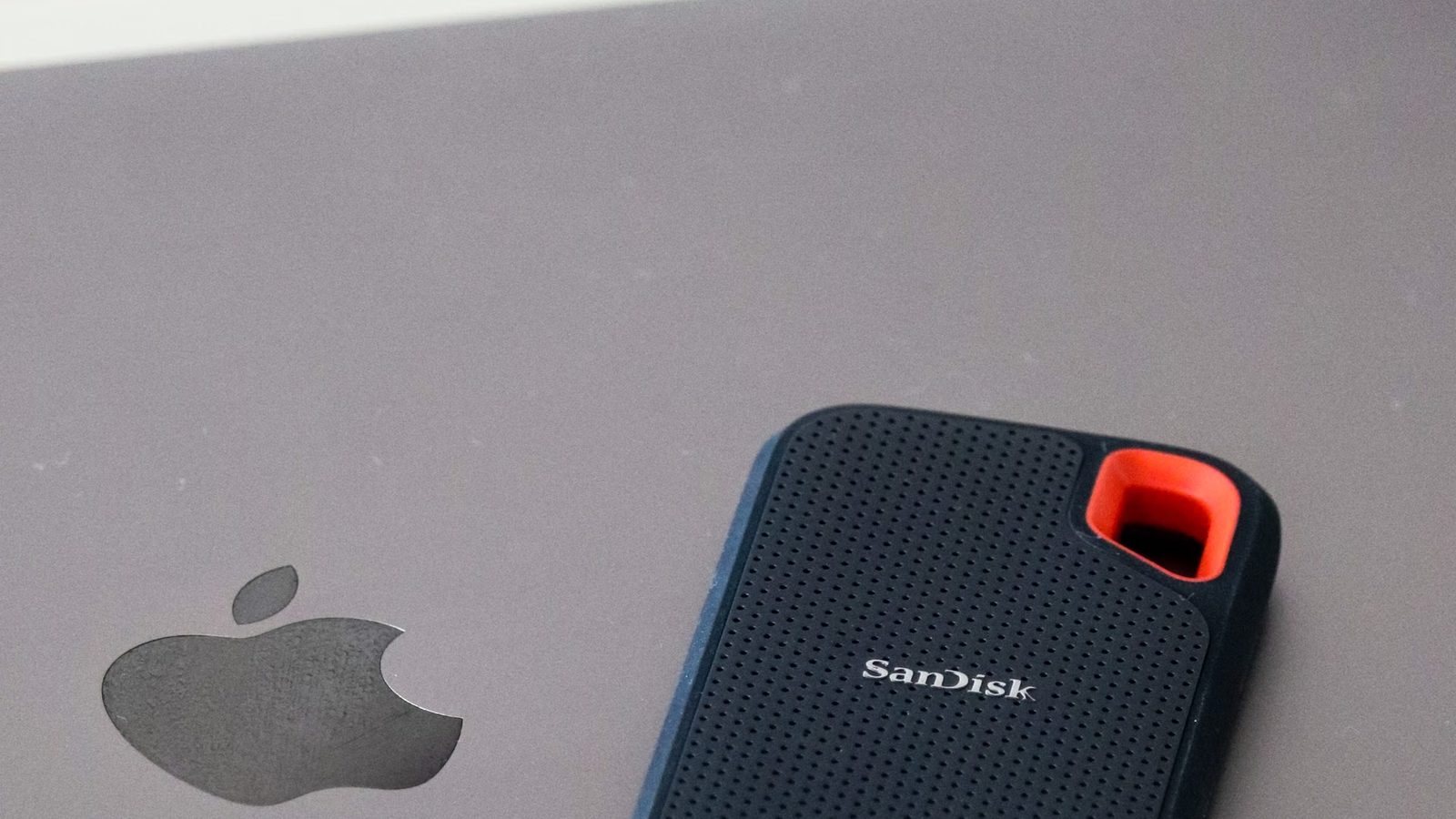 External drive with a backup next to a laptop