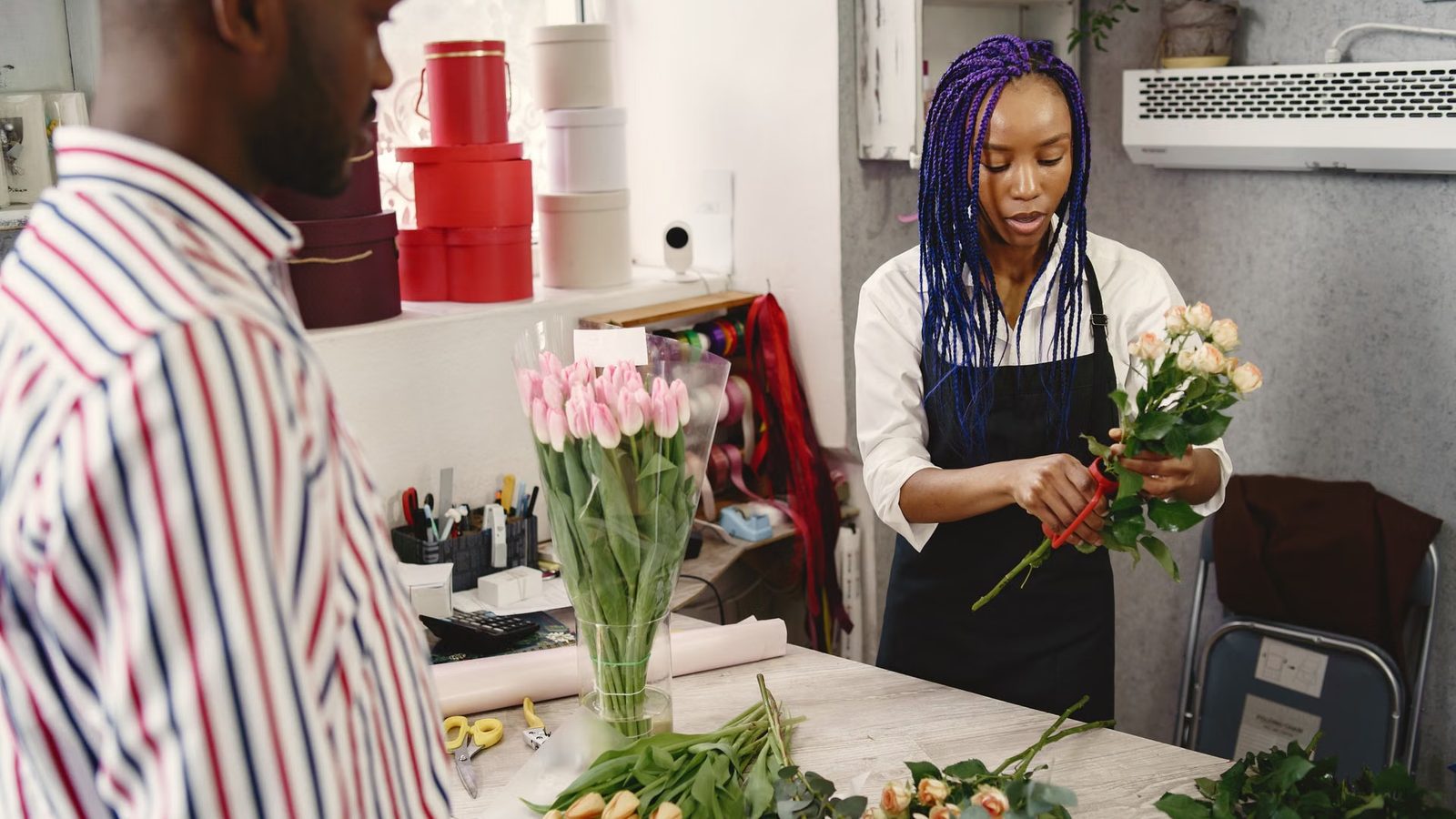 Florist arranging a bouquet in her workshop