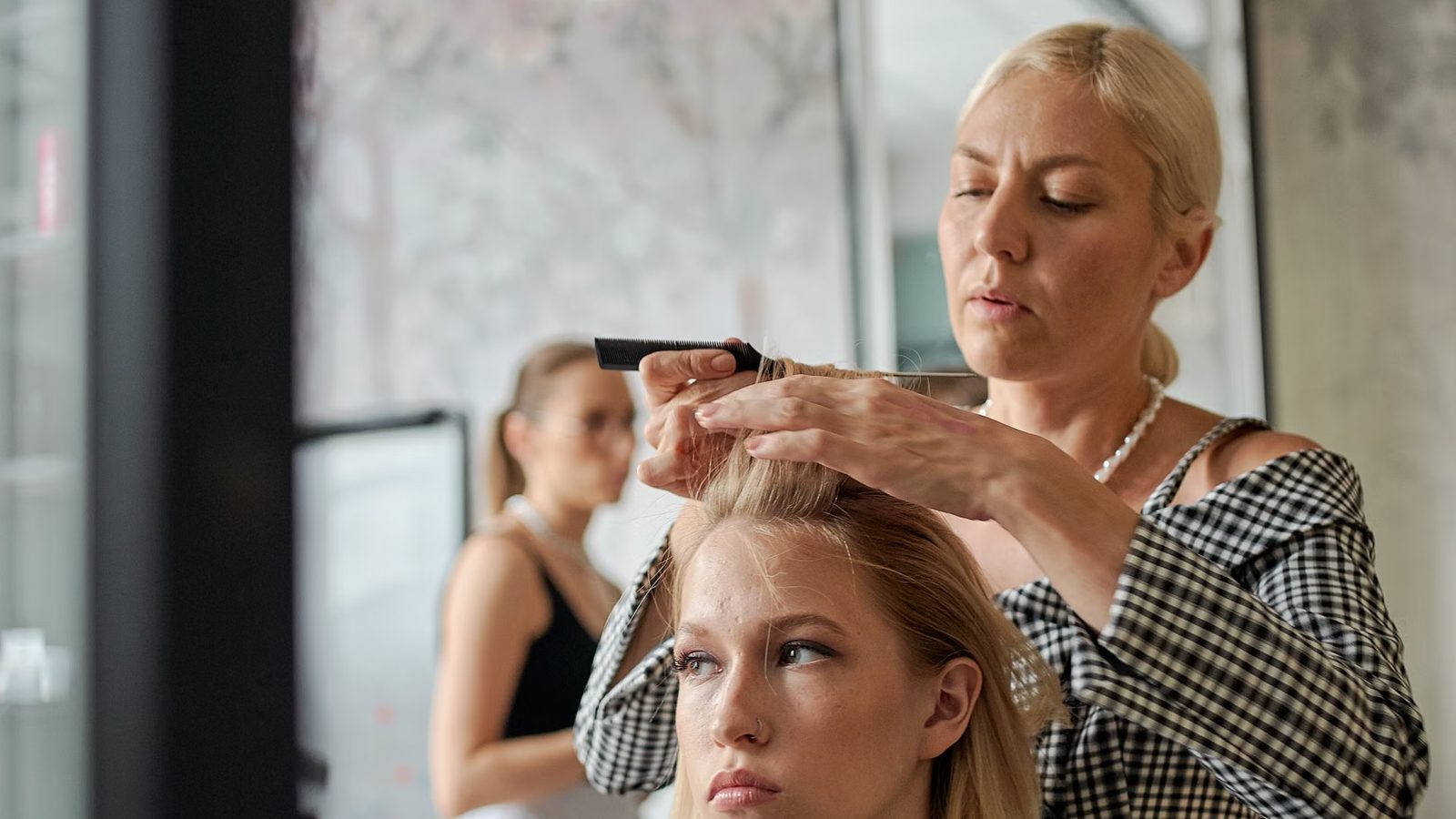Hairdresser working with a client in a salon