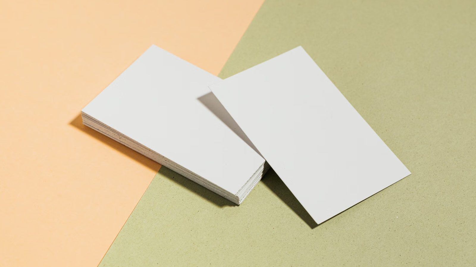 Plain business cards on a two-tone background
