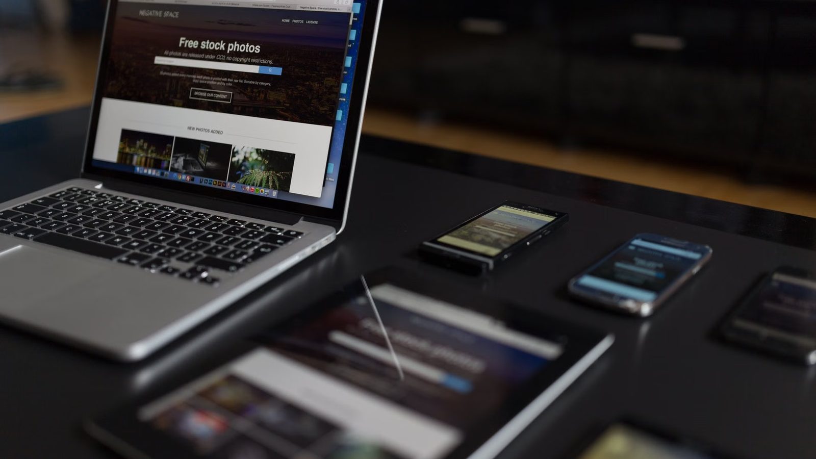 Web designer's desk with a laptop and layout sketches