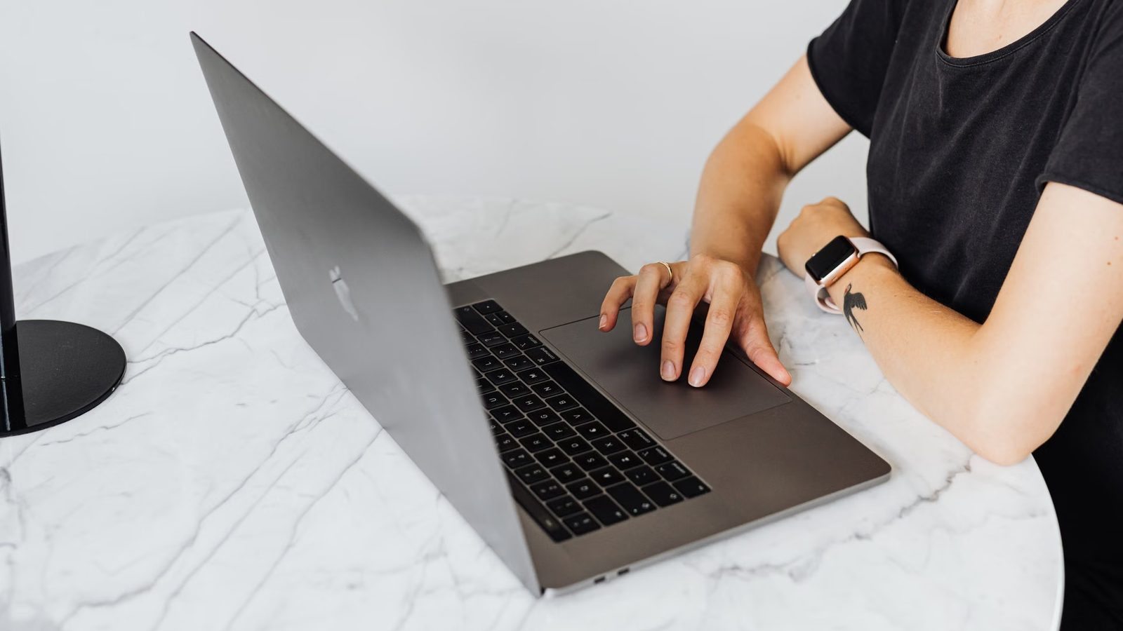 Working on a laptop at a bright desk
